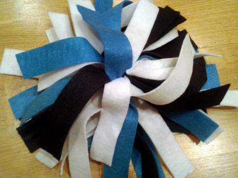 DIY navy and white cheer uniform pom pom detail